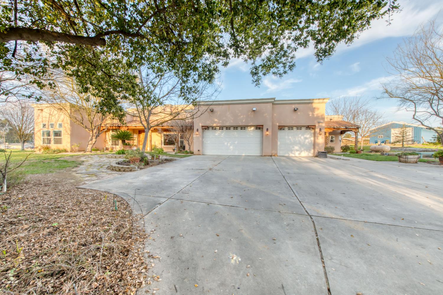 17433 El Dorado Madera, CA 93636 - Photo 1 of 49 a view of a road with a building in the background