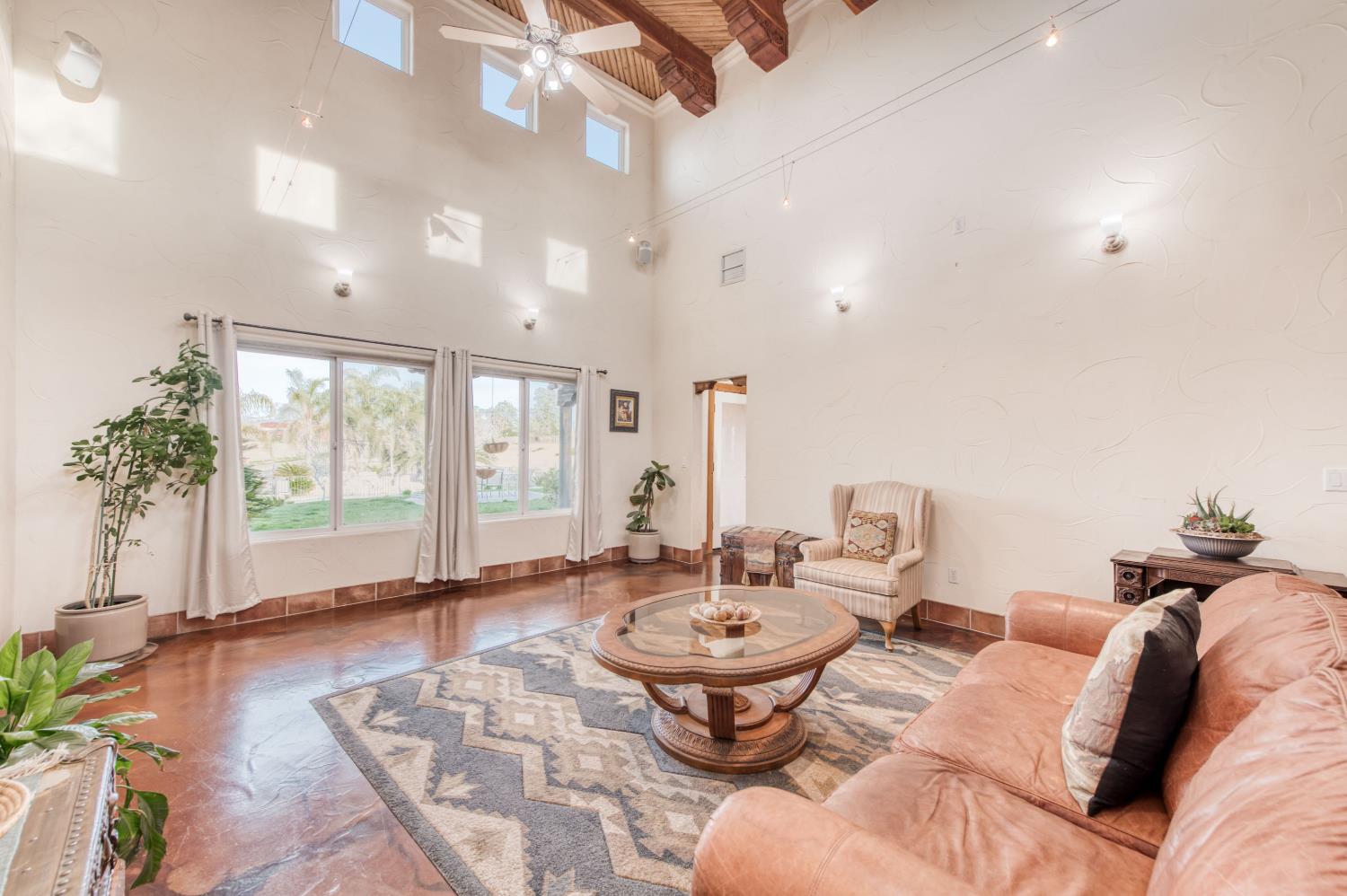 17433 El Dorado Madera, CA 93636 - Photo 11 of 49 a living room with furniture and a large window