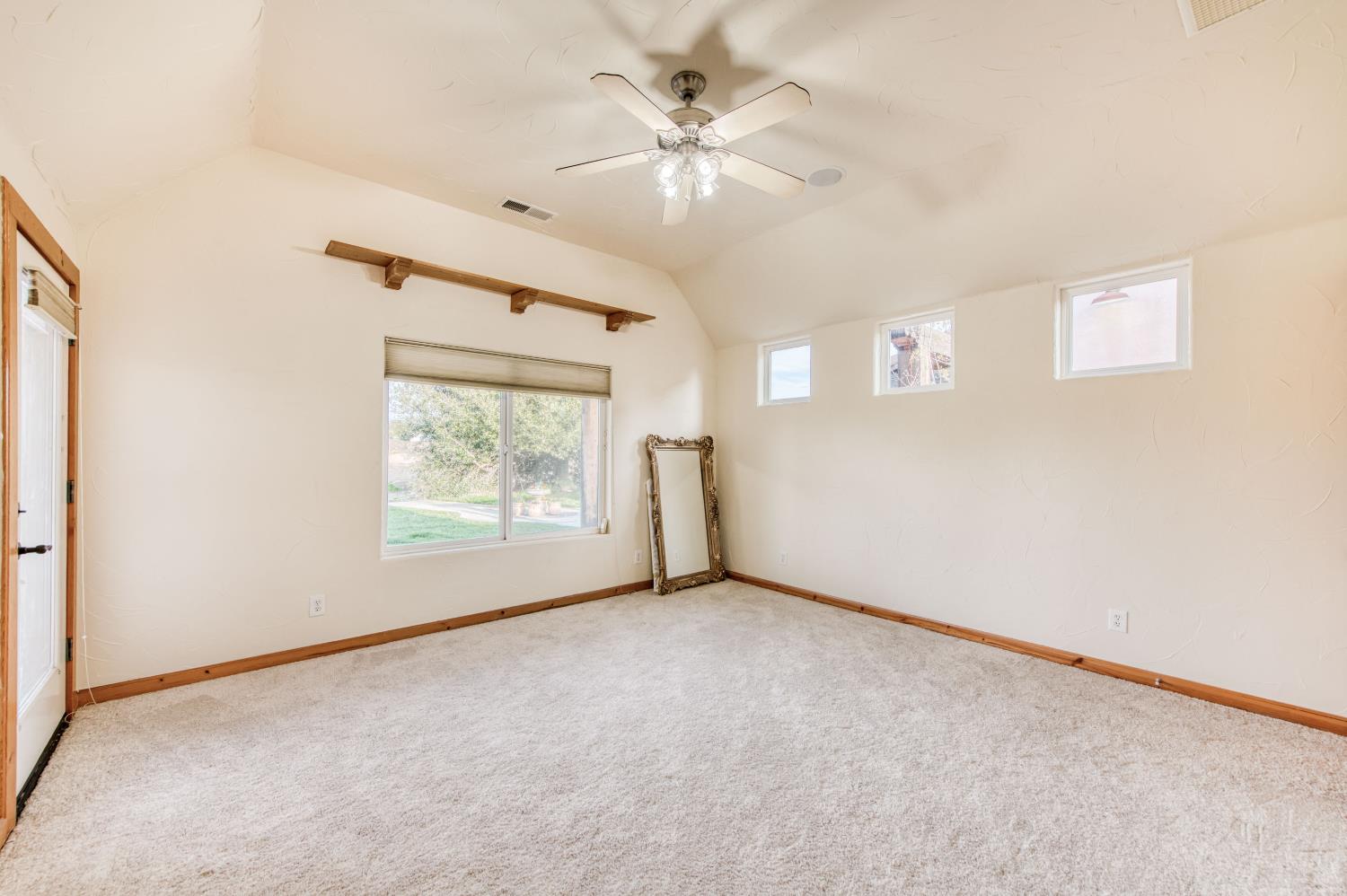 17433 El Dorado Madera, CA 93636 - Photo 26 of 49 an empty room with windows and fan