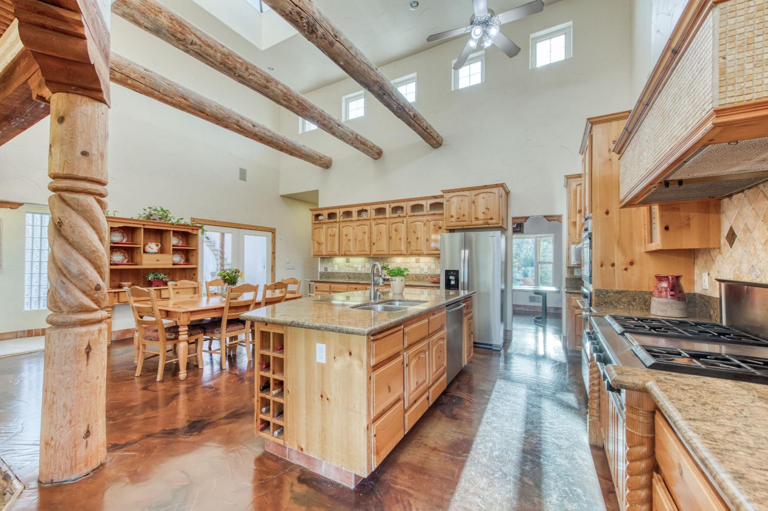 17433 El Dorado Madera, CA 93636 - Photo 30 of 49 a kitchen with a stove top oven cabinets and a counter top space