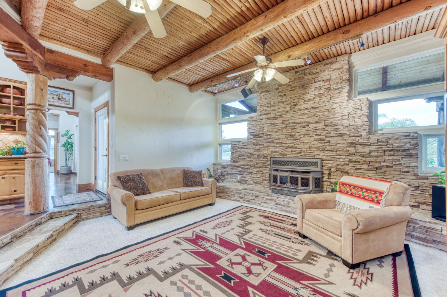 17433 El Dorado Madera, CA 93636 - Photo 37 of 49 a living room with furniture and a fireplace