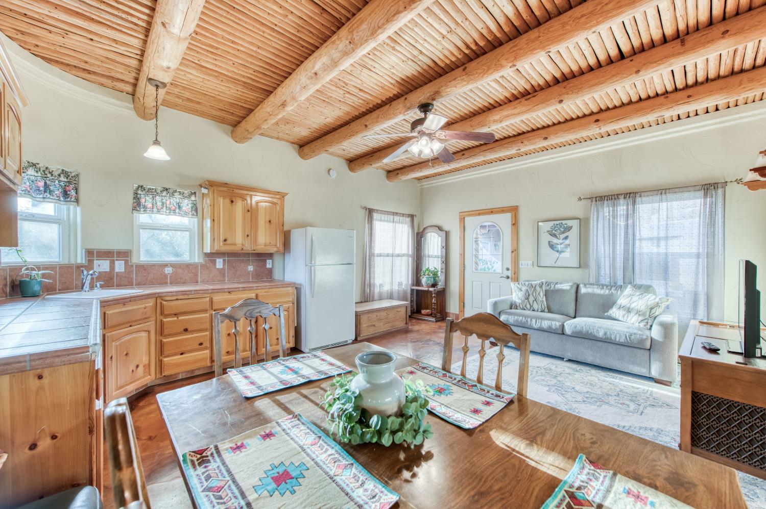 17433 El Dorado Madera, CA 93636 - Photo 42 of 49 a large living room with stainless steel appliances kitchen island granite countertop furniture and a kitchen view