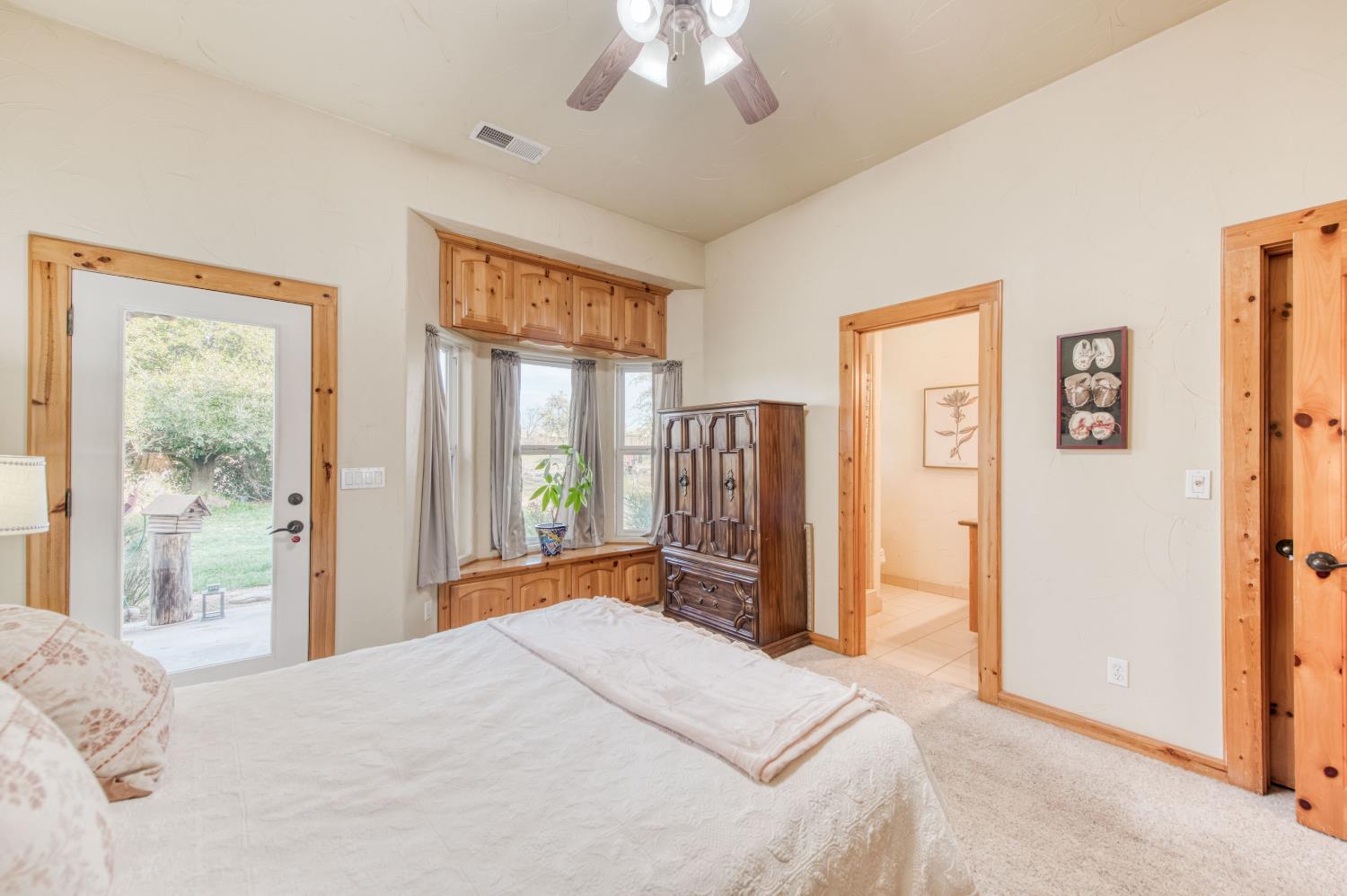 17433 El Dorado Madera, CA 93636 - Photo 46 of 49 a bedroom with a large bed and a large window