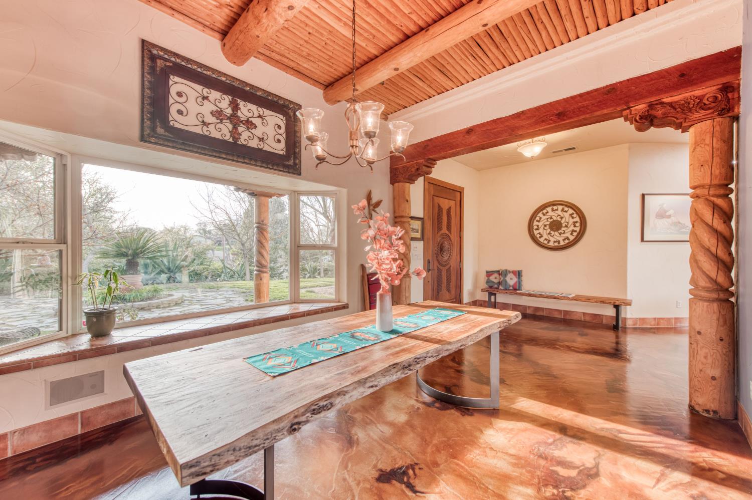 17433 El Dorado Madera, CA 93636 - Photo 7 of 49 a living room with a table and a large window