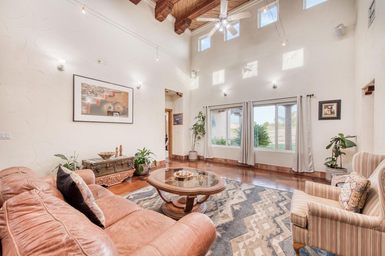 17433 El Dorado Madera, CA 93636 - Photo 10 of 49 a living room with furniture and a large window