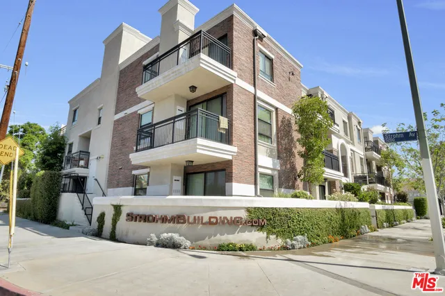 a view of a building with a street