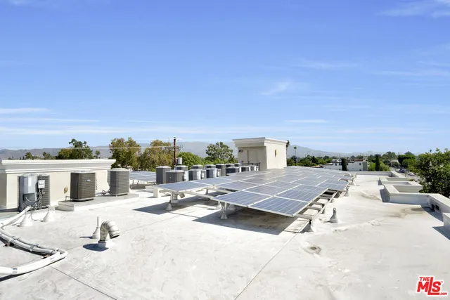 an aerial view of residential houses and city view