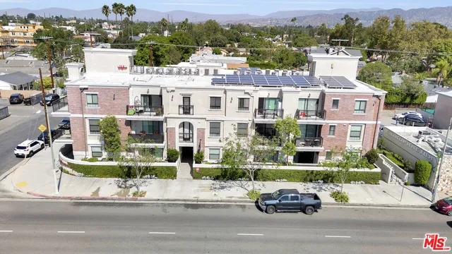 a car parked in front of a white building