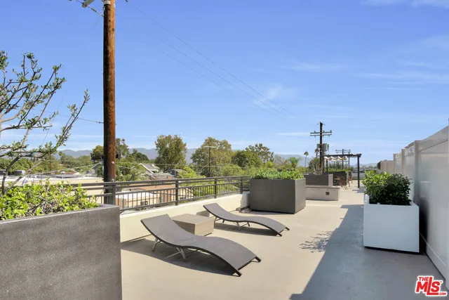 a view of parking garage with cars