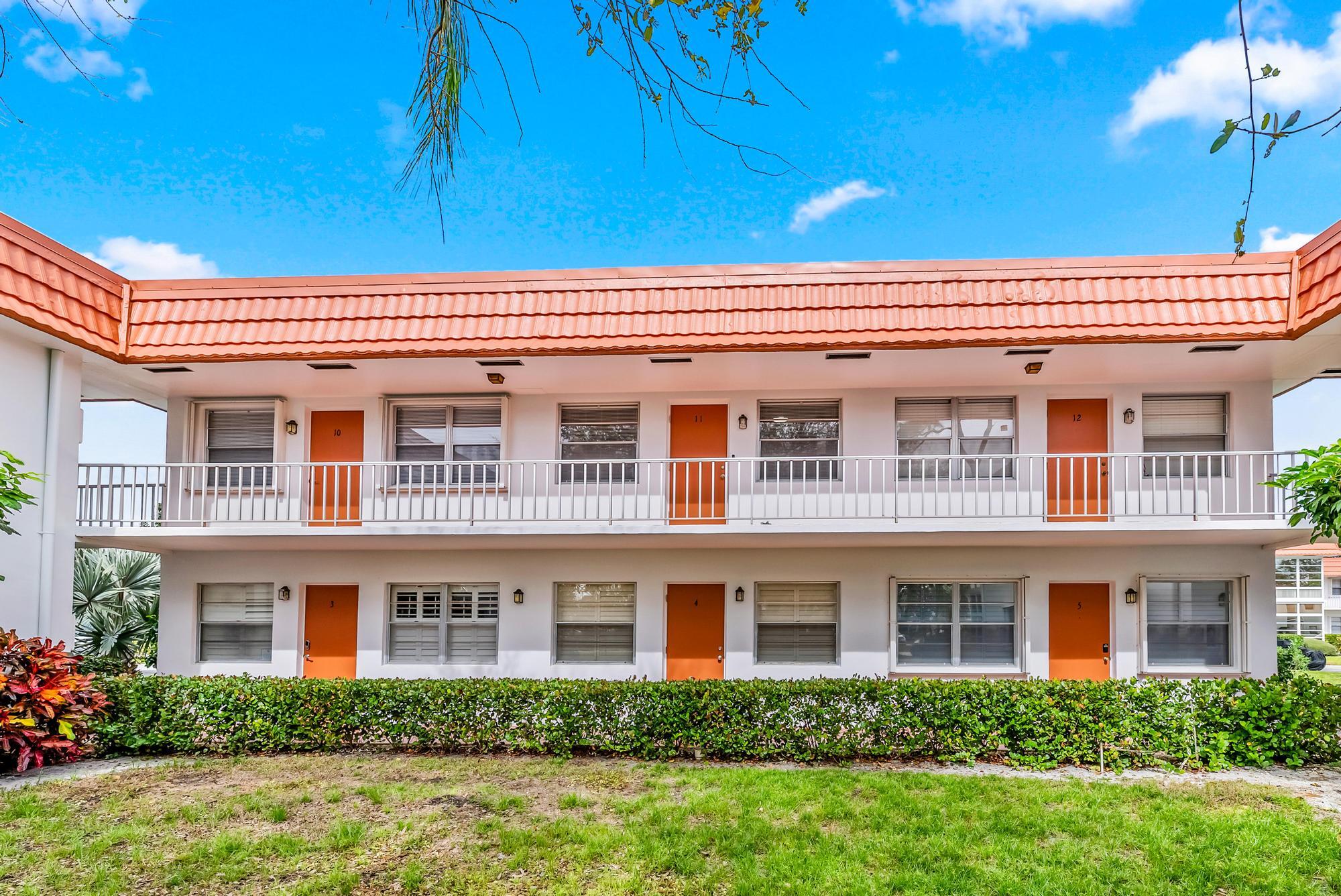 2600 Southeast Ocean Boulevard, Unit A11 Stuart, FL 34996 - Photo 12 of 12 a front view of a house with a yard