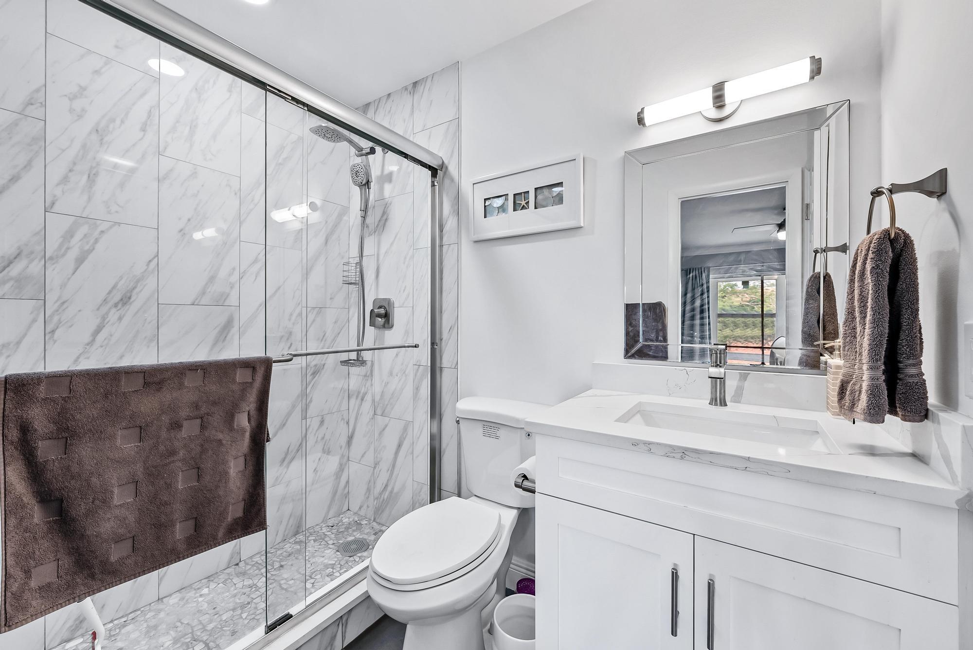 2600 Southeast Ocean Boulevard, Unit A11 Stuart, FL 34996 - Photo 10 of 12 a bathroom with a sink and a mirror