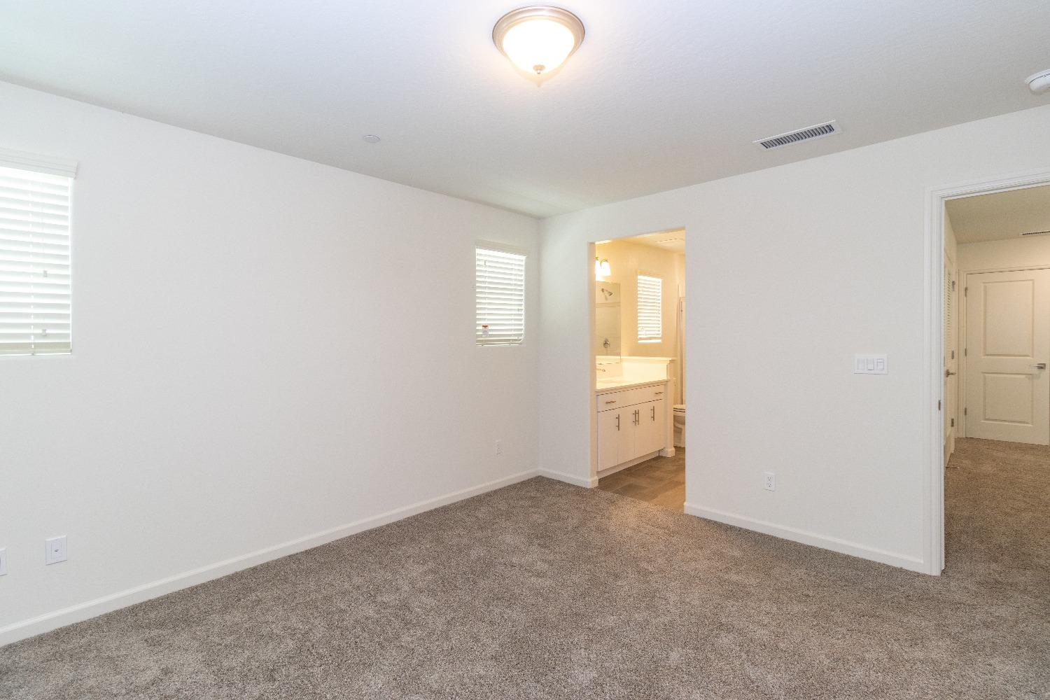 512 Pioneer Lane Clovis, CA 93619 - Photo 13 of 17 a view of an empty room with a window