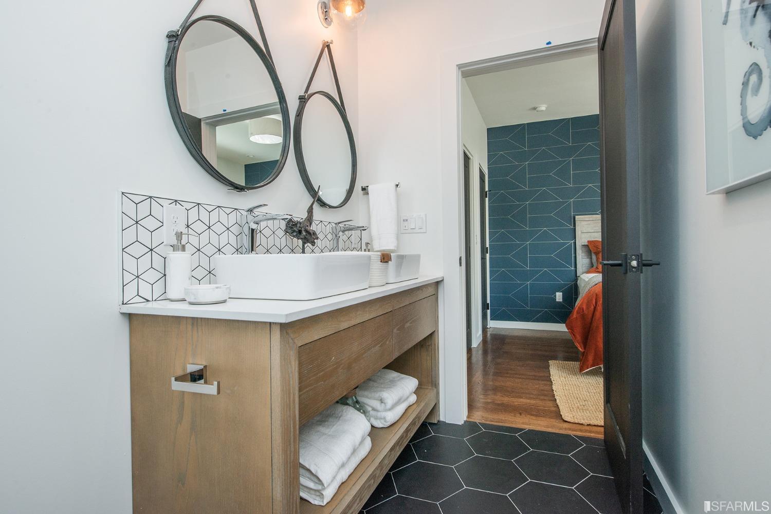 2422 Bonar Street Berkeley, CA 94702 - Photo 24 of 54 a bathroom with a sink and a mirror