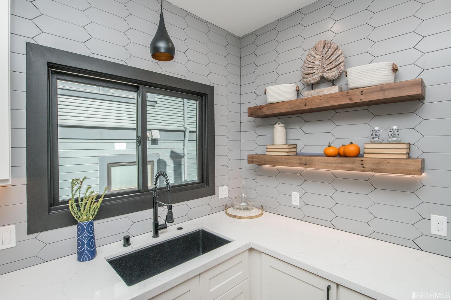 2422 Bonar Street Berkeley, CA 94702 - Photo 26 of 54 a kitchen with a sink and a stove next to a window