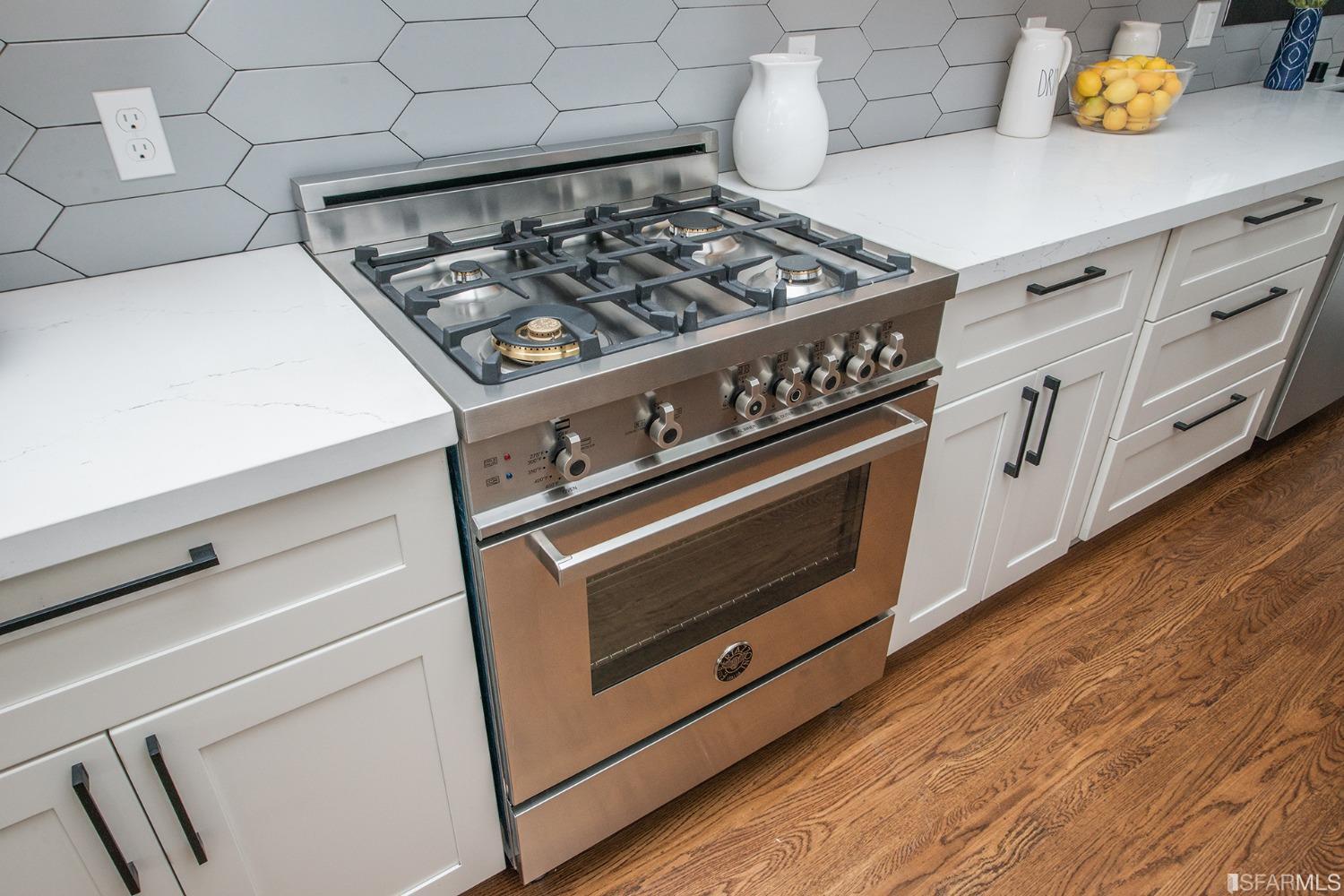 2422 Bonar Street Berkeley, CA 94702 - Photo 29 of 54 a stove top oven sitting inside of a kitchen
