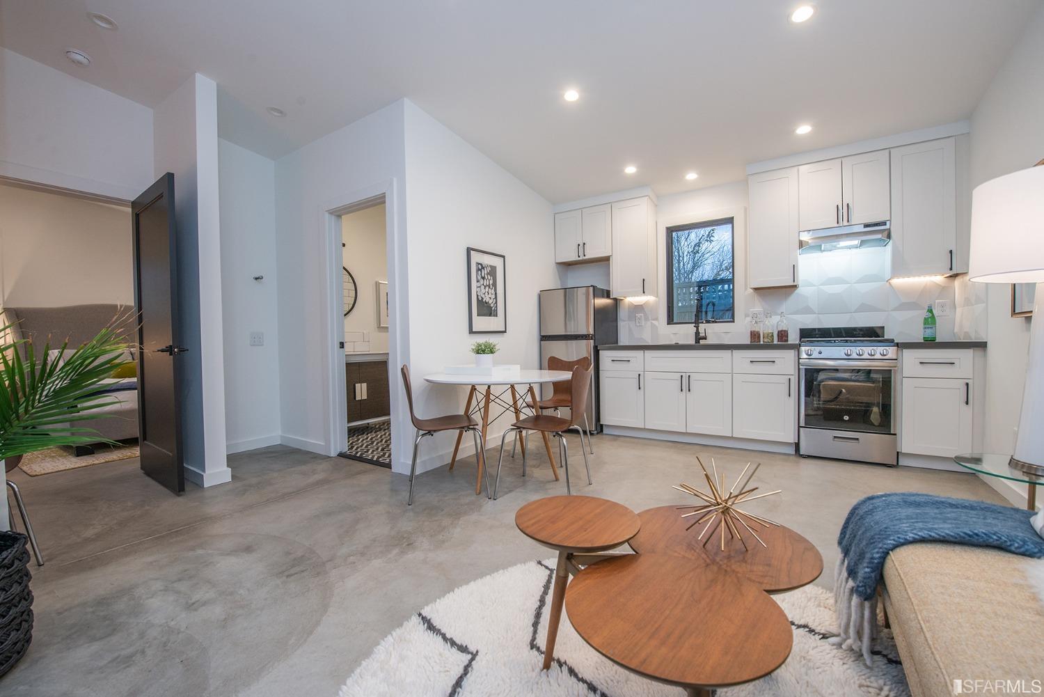 2422 Bonar Street Berkeley, CA 94702 - Photo 46 of 54 a living room with furniture a dining table and a fireplace