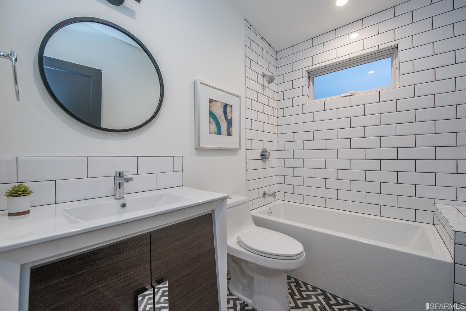 2422 Bonar Street Berkeley, CA 94702 - Photo 50 of 54 a bathroom with a sink a toilet and bathtub