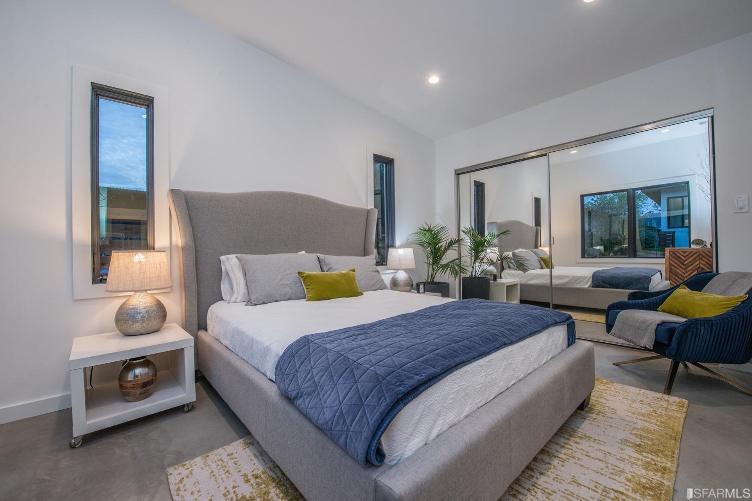 2422 Bonar Street Berkeley, CA 94702 - Photo 52 of 54 a bedroom with a bed and wooden floor