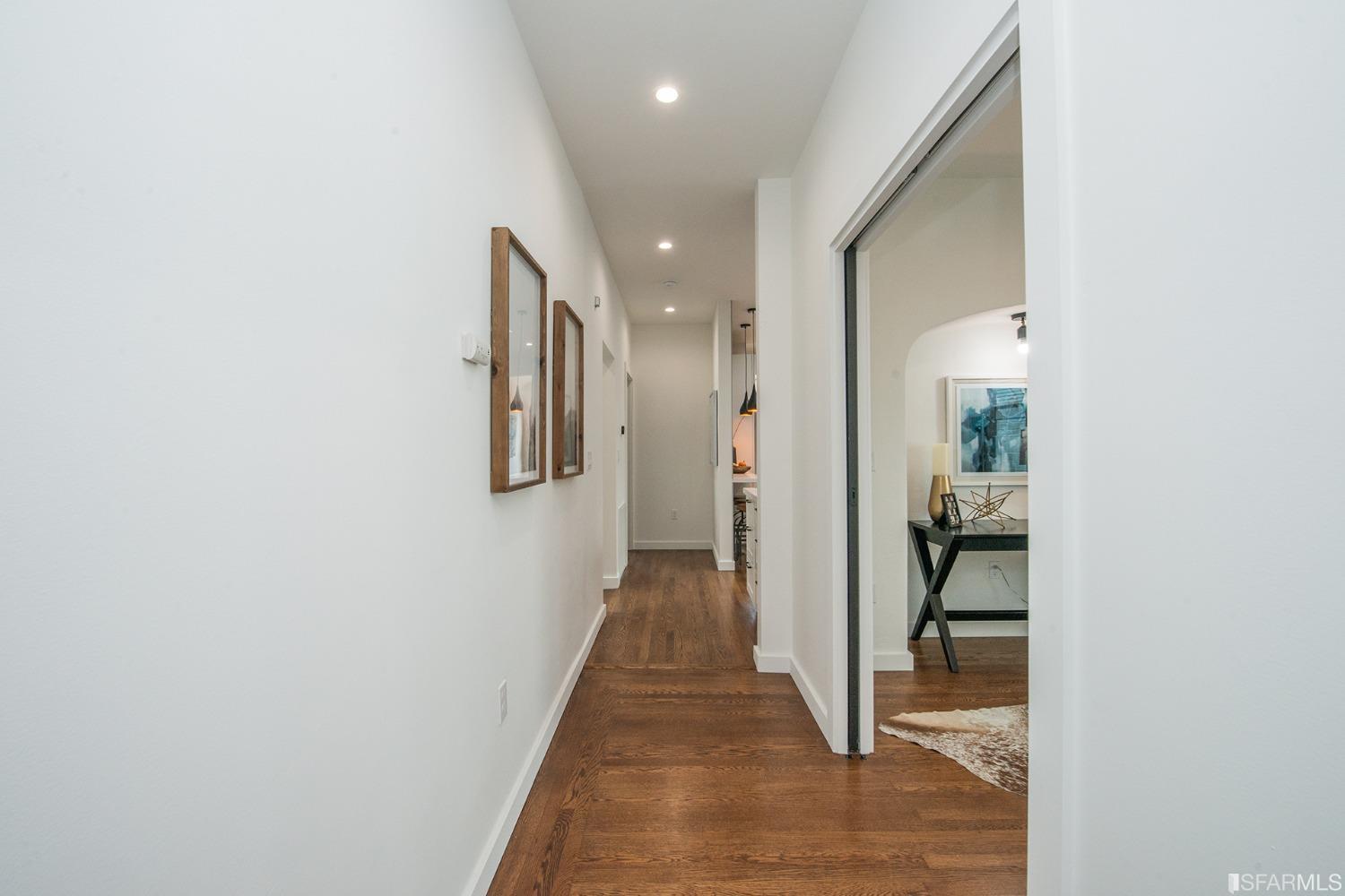 2422 Bonar Street Berkeley, CA 94702 - Photo 10 of 54 a view of a hallway with wooden floor and a bathroom