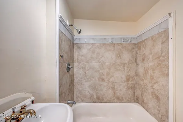 a bathroom with a sink and mirror