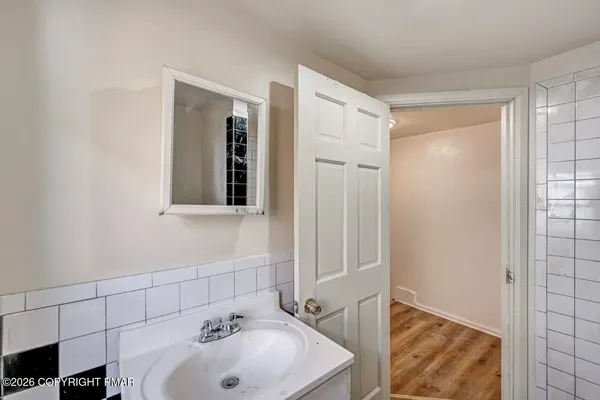 a bathroom with a sink and shower