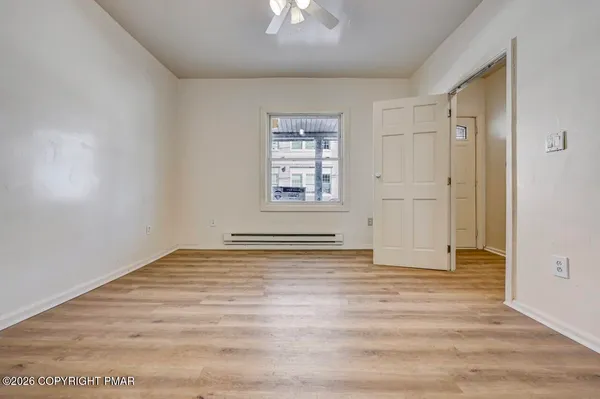 a view of an empty room with a window
