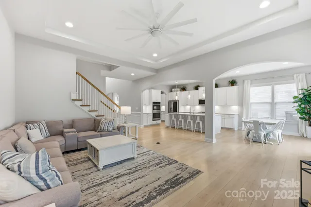 a living room with furniture and white walls