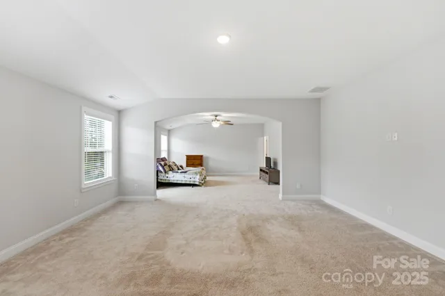 a view of a livingroom with a car and window