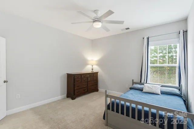 a bedroom with furniture and window