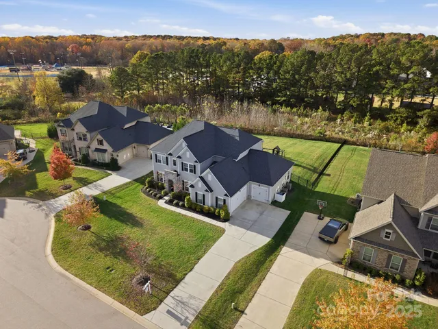 an aerial view of a house with a lake view