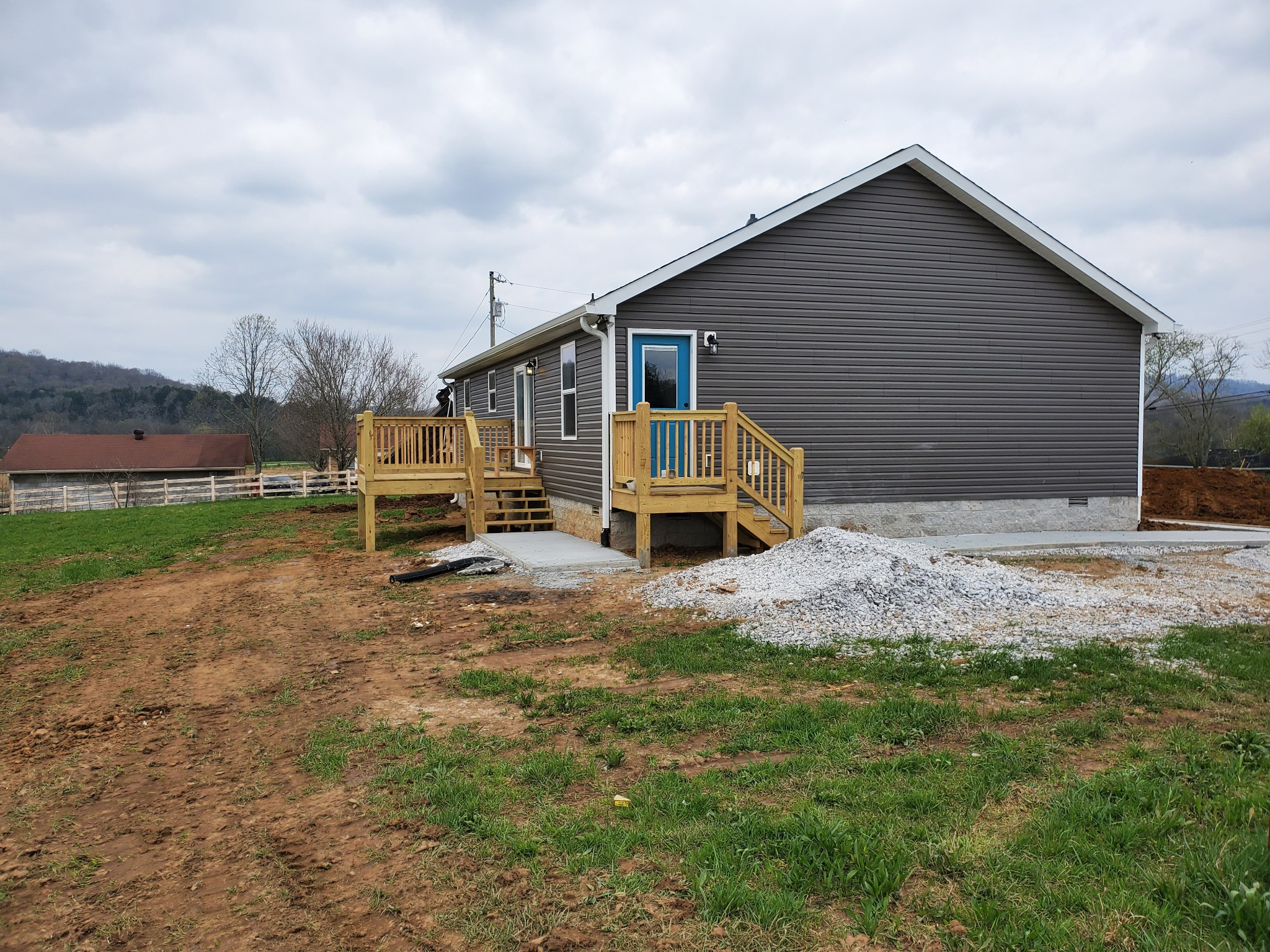 433 Hickman Road Liberty, TN 37095 - Photo 3 of 18 a front view of a house with a yard