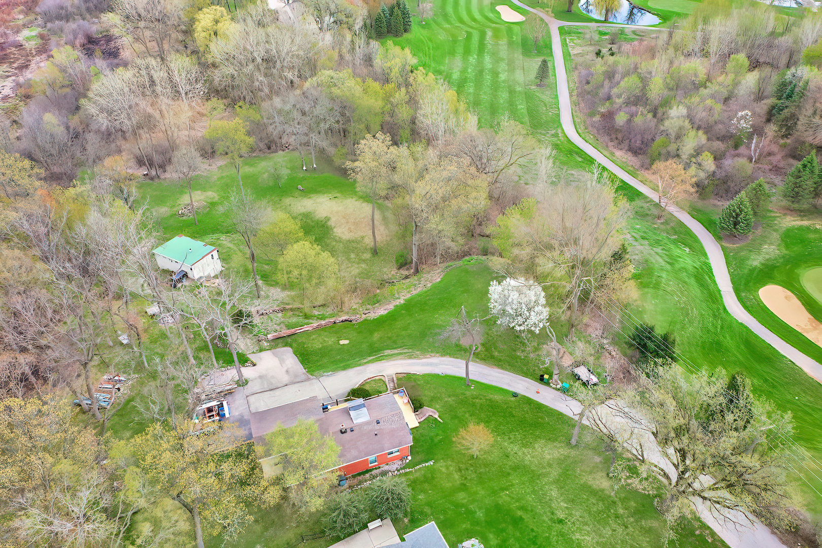 28660 Golf View Drive Spring Grove, IL 60081 - Photo 4 of 25 a backyard of a house with lots of green space