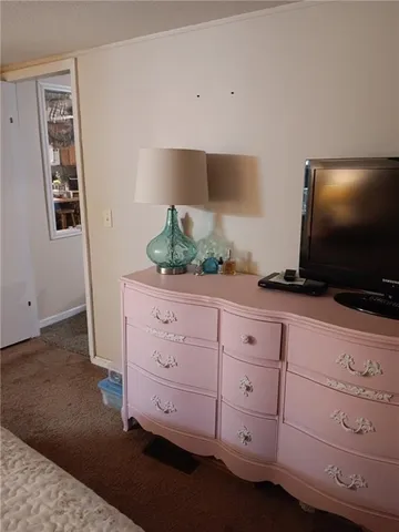 a living room with cabinets and flat screen tv