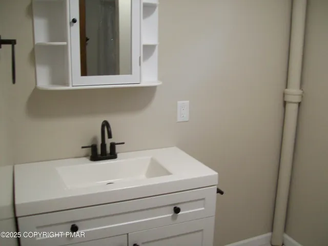 a bathroom with a toilet and sink
