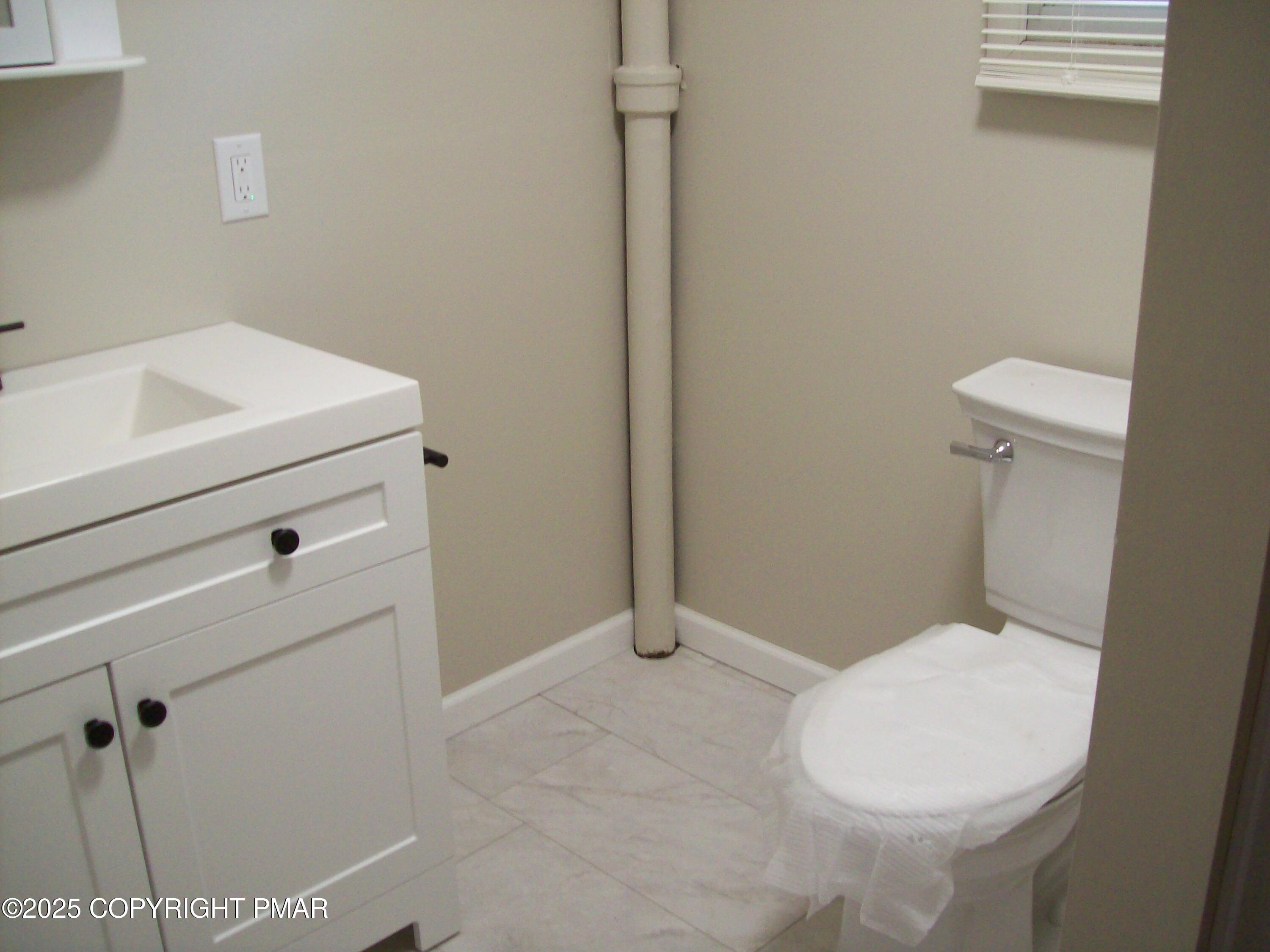 116 Kasak Road East Stroudsburg, PA 18302 - Photo 12 of 17 a bathroom with a toilet and sink