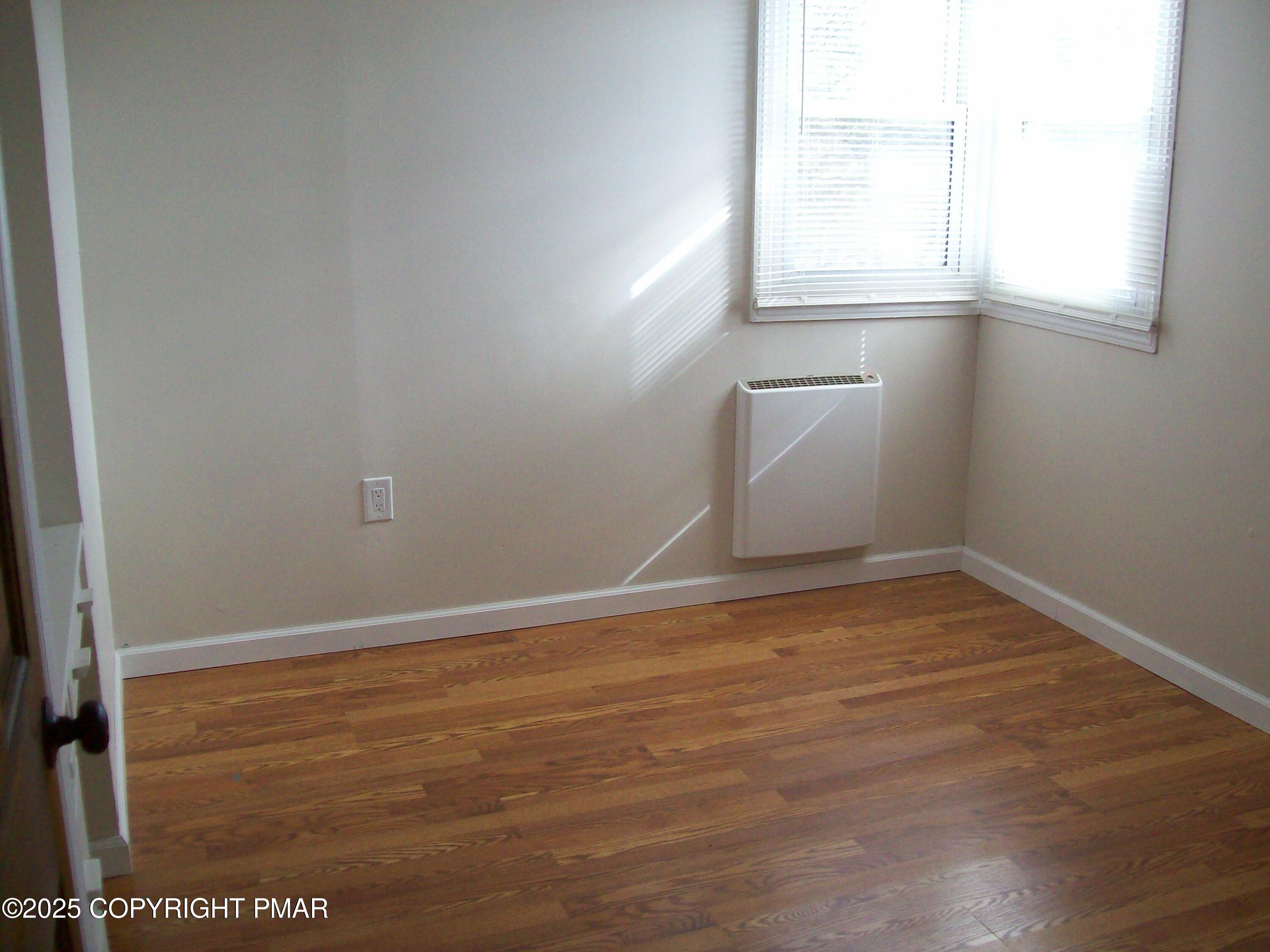 116 Kasak Road East Stroudsburg, PA 18302 - Photo 17 of 17 an empty room with a window
