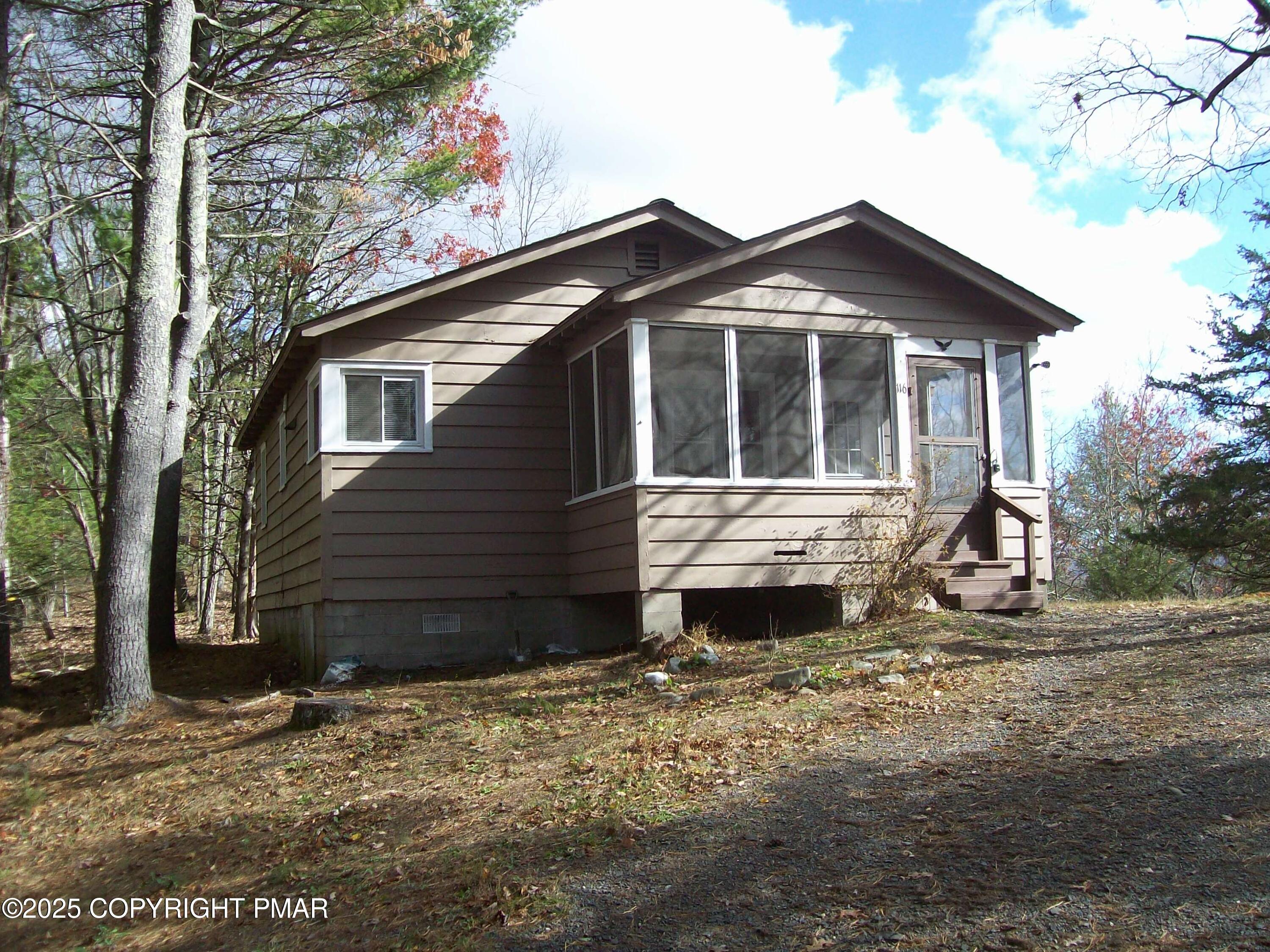 116 Kasak Road East Stroudsburg, PA 18302 - Photo 2 of 17 a front view of a house with a yard
