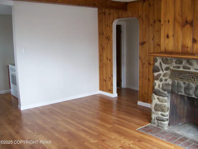 a view of front door with wooden floor