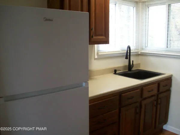 a kitchen with a sink and a window