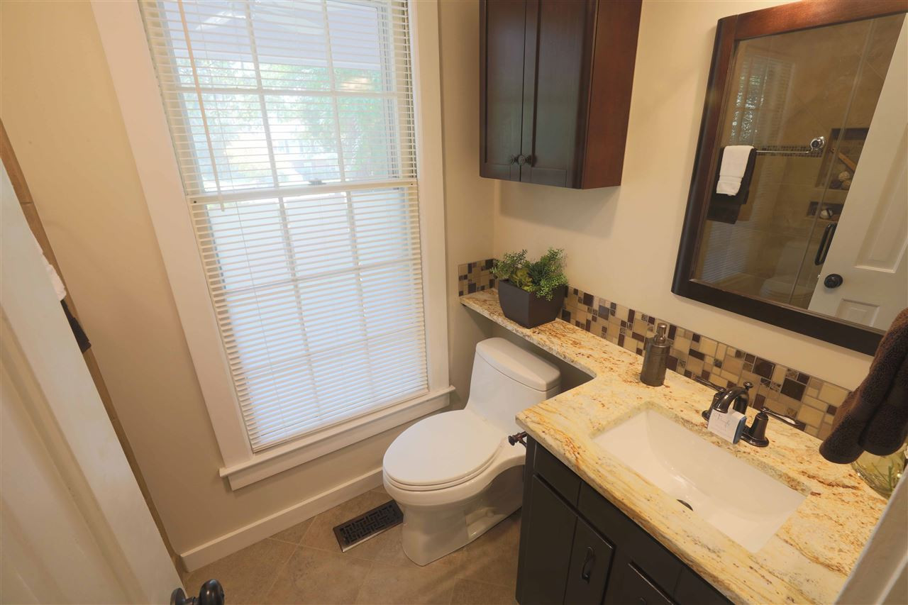 2017 Mallard Lane Raleigh, NC 27609 - Photo 14 of 25 New sink, granite countertop, tile floor. First floor master en suite