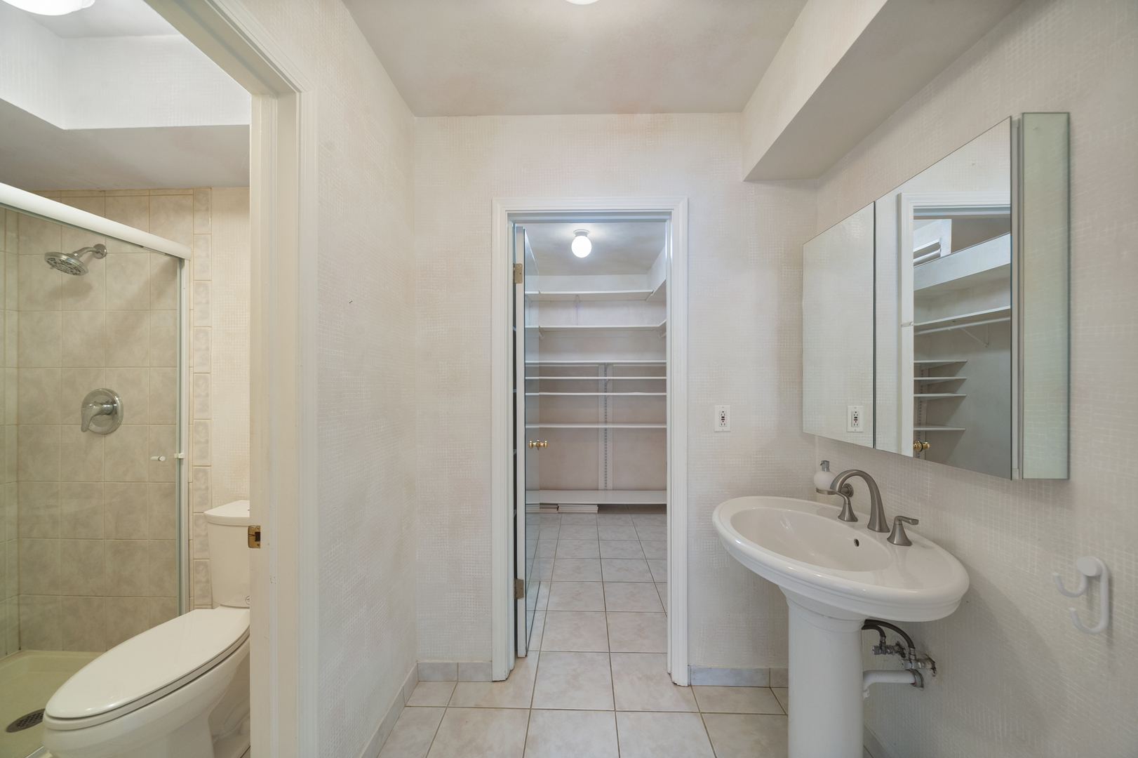 4949 Golf Road, Unit 101 Skokie, IL 60077 - Photo 13 of 22 a bathroom with a sink toilet and shower