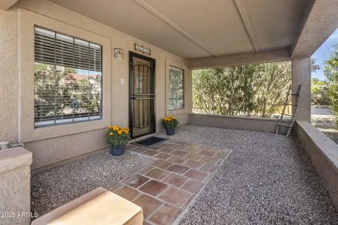 a view of an empty room with windows
