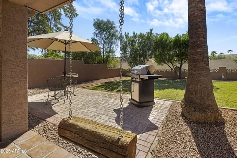 a view of a swimming pool with a patio