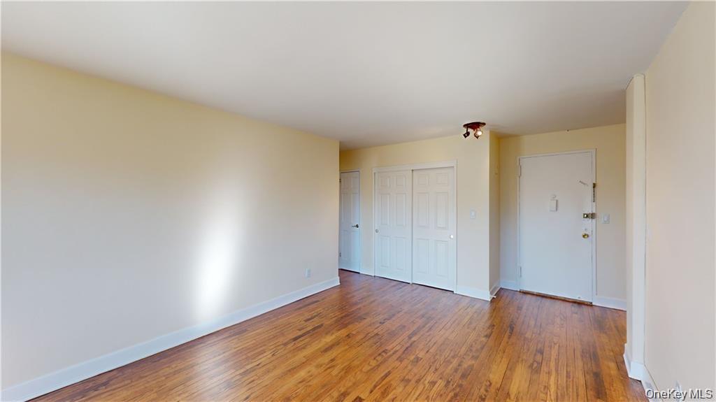 4200 Herkimer Place, Unit 4E Bronx, NY 10470 - Photo 3 of 8 Unfurnished bedroom featuring wood finished floors and a closet