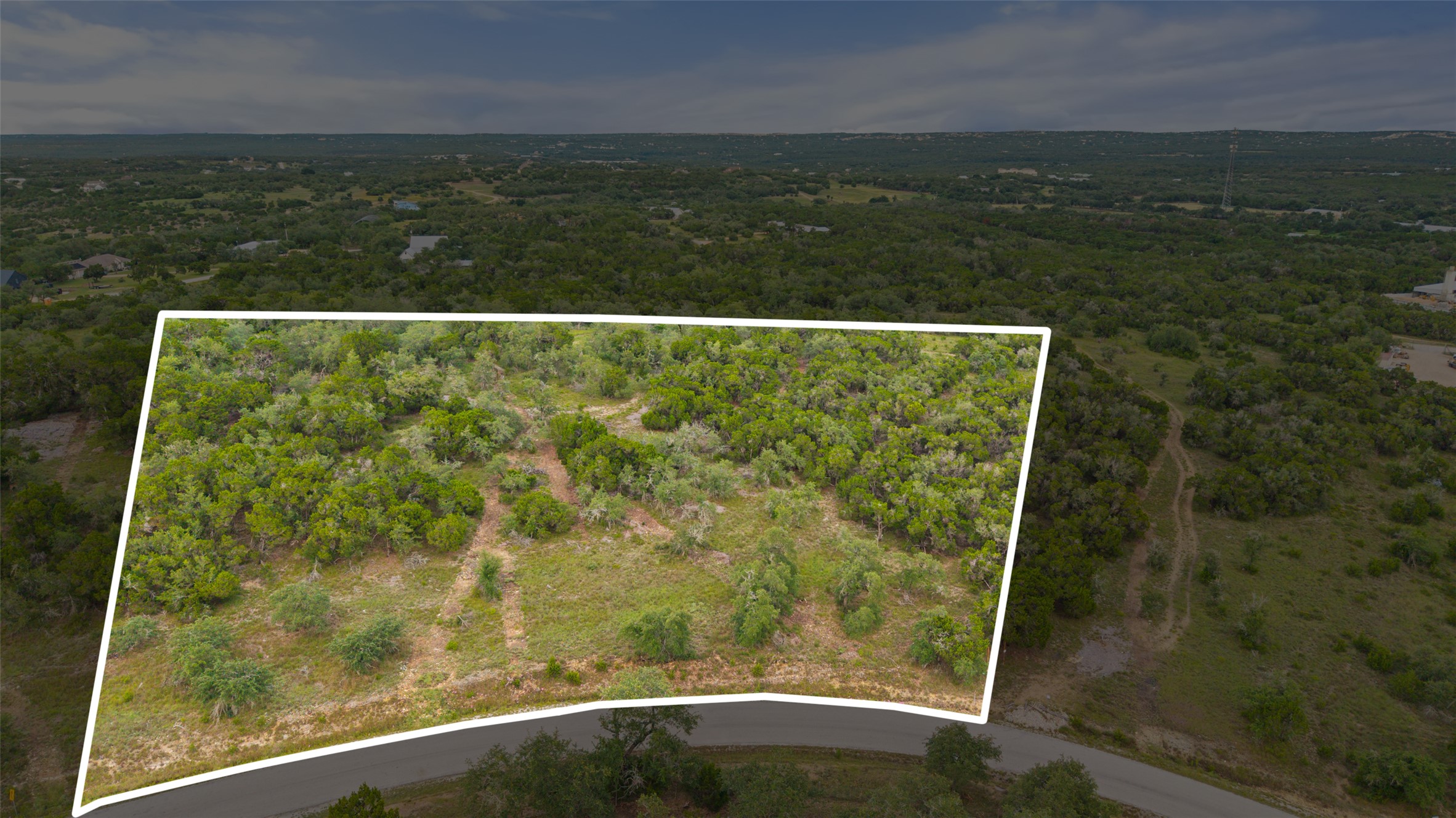 0 Mirela Ann Road Dripping Springs, TX 78620 - Photo 1 of 11 Vast, verdant acreage awaits your vision, nestled alongside a quiet, curving road.