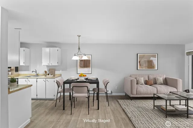 a view of a livingroom with furniture and a table