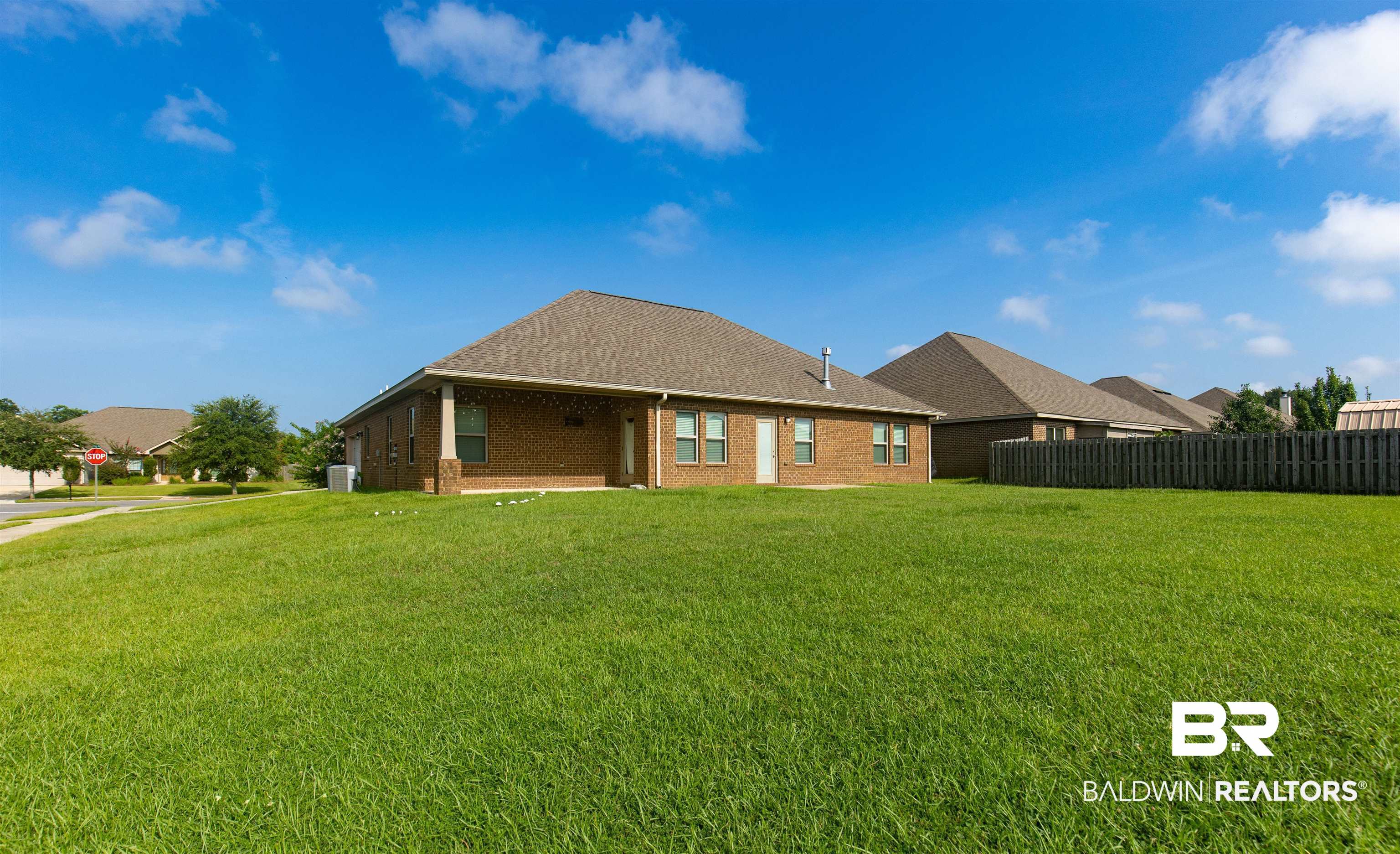 122 Open Field Drive Fairhope, AL 36532 - Photo 25 of 27 Rear view of house with a yard