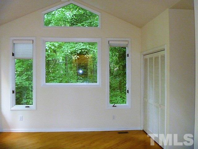 2951 Rue Sans Famille Raleigh, NC 27607 - Photo 14 of 25 a view of a bedroom with a window and swimming pool