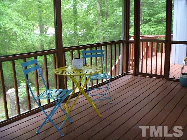 2951 Rue Sans Famille Raleigh, NC 27607 - Photo 22 of 25 a view of a balcony with wooden floor