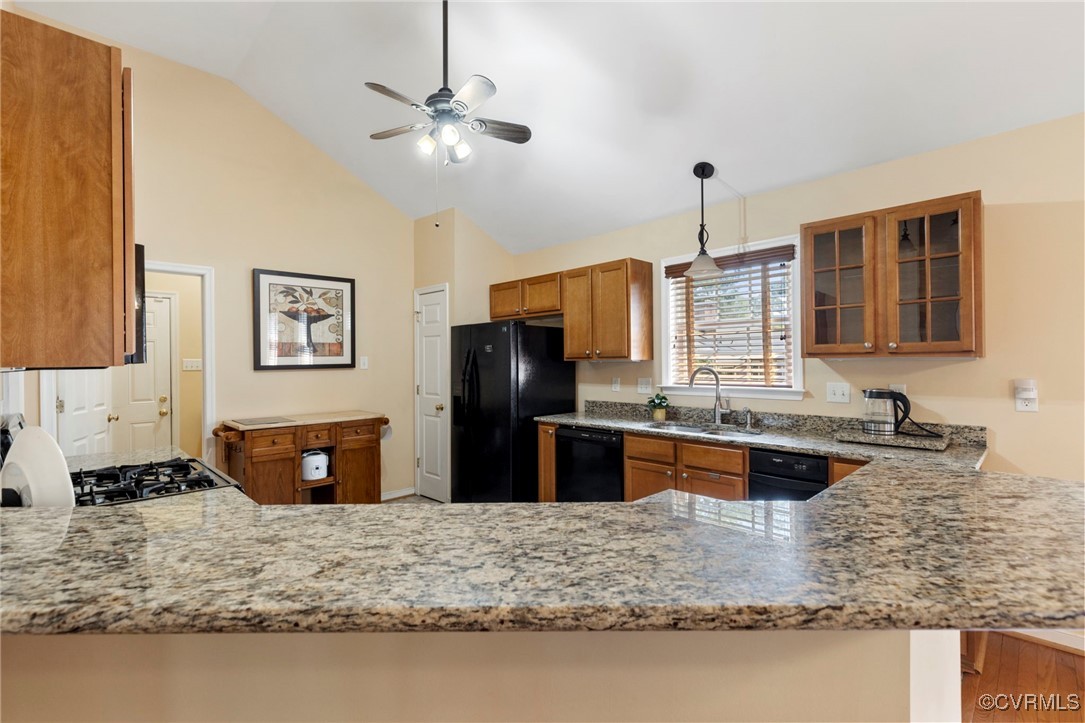 2901 Kingsdale Road North Chesterfield, VA 23237 - Photo 17 of 22 a kitchen with stainless steel appliances granite countertop a sink refrigerator stove and microwave